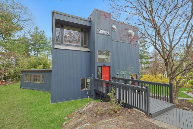 exterior space with a lawn and a wooden deck