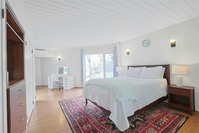 bedroom featuring wood ceiling and light wood finished floors