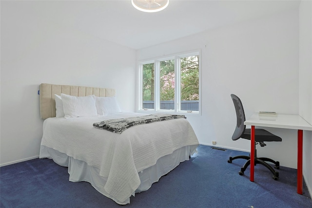 bedroom featuring baseboards, carpet, and visible vents