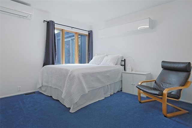 bedroom with baseboards, a wall mounted AC, carpet flooring, and visible vents