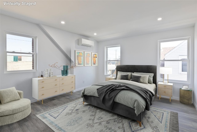 82 Albertson Pl, Mineola, NY 11501 - bedroom featuring an AC wall unit, recessed lighting, and wood finished floors