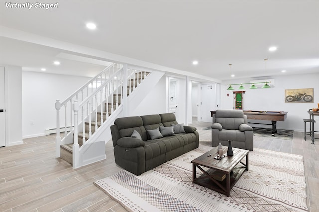 82 Albertson Pl, Mineola, NY 11501 - living room with pool table, stairway, a baseboard heating unit, recessed lighting, and light wood-style flooring