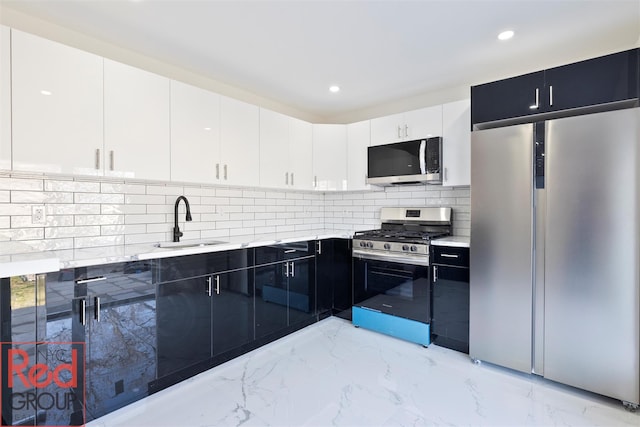 82 Albertson Pl, Mineola, NY 11501 - kitchen with a sink, appliances with stainless steel finishes, light countertops, and marble finish floor