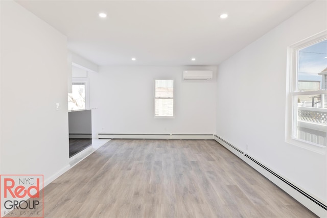 82 Albertson Pl, Mineola, NY 11501 - unfurnished room with wood finished floors, a baseboard heating unit, baseboard heating, and a wealth of natural light