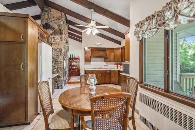 59 Giant Oak Rd, Ridge, NY 11961 - dining space with radiator, light tile patterned flooring, and a ceiling fan