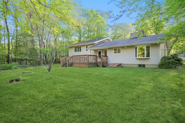 59 Giant Oak Rd, Ridge, NY 11961 - back of property with a wooden deck, a lawn, and a chimney