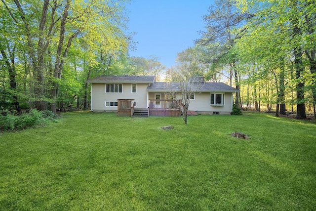 59 Giant Oak Rd, Ridge, NY 11961 - back of house featuring a wooden deck and a lawn