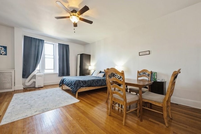 1185 E Broadway Unit 4A, Hewlett, NY 11557 - bedroom with baseboards, ceiling fan, and wood finished floors