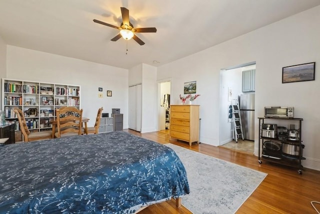 1185 E Broadway Unit 4A, Hewlett, NY 11557 - bedroom with baseboards, ceiling fan, wood finished floors, and freestanding refrigerator