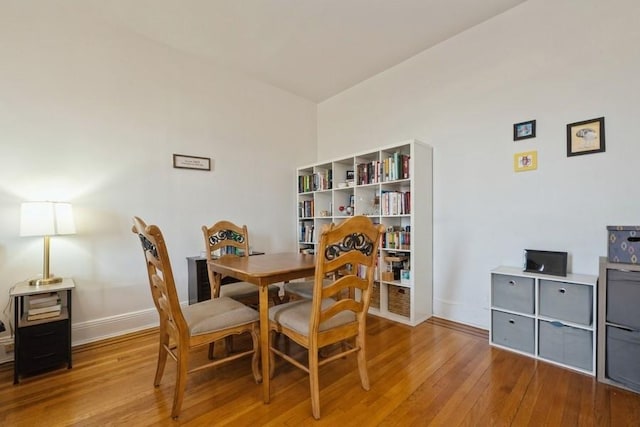 1185 E Broadway Unit 4A, Hewlett, NY 11557 - dining area featuring hardwood / wood-style floors and baseboards