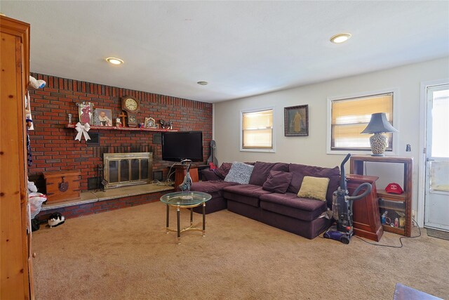 living area featuring recessed lighting, a fireplace, and carpet floors