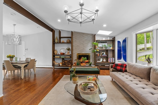 57 Hamilton Dr, Chappaqua, NY 10514 - living area featuring a chandelier, wood finished floors, a stone fireplace, and recessed lighting