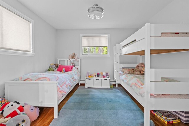 57 Hamilton Dr, Chappaqua, NY 10514 - bedroom with a baseboard radiator and wood finished floors