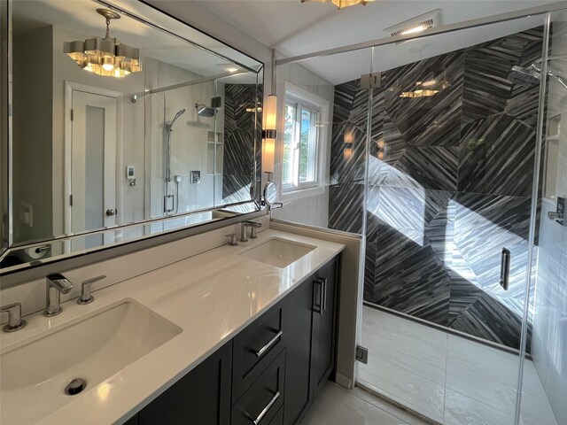57 Hamilton Dr, Chappaqua, NY 10514 - full bathroom with double vanity, a shower stall, tile patterned flooring, and a chandelier
