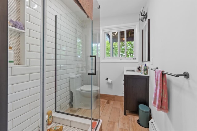 57 Hamilton Dr, Chappaqua, NY 10514 - full bath featuring toilet, wood finished floors, a shower stall, vanity, and baseboards
