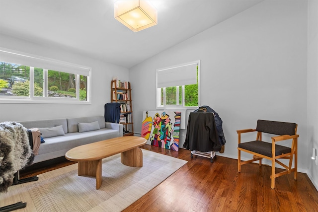 57 Hamilton Dr, Chappaqua, NY 10514 - living area featuring vaulted ceiling, wood finished floors, and baseboards