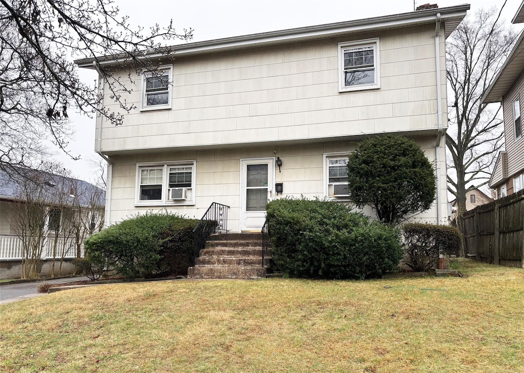 111 Holland Ave, White Plains, NY 10603 - colonial inspired home with a front yard and fence