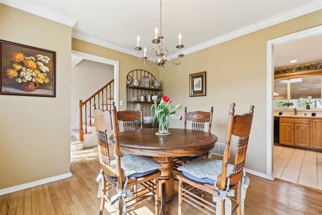 dining area with an inviting chandelier, baseboards, stairway, and light wood-style floors