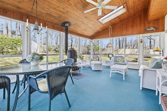 sunroom / solarium with a skylight, ceiling fan, an outdoor hangout area, and outdoor dining area
