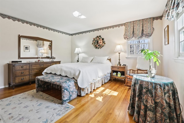 bedroom with light wood-style floors