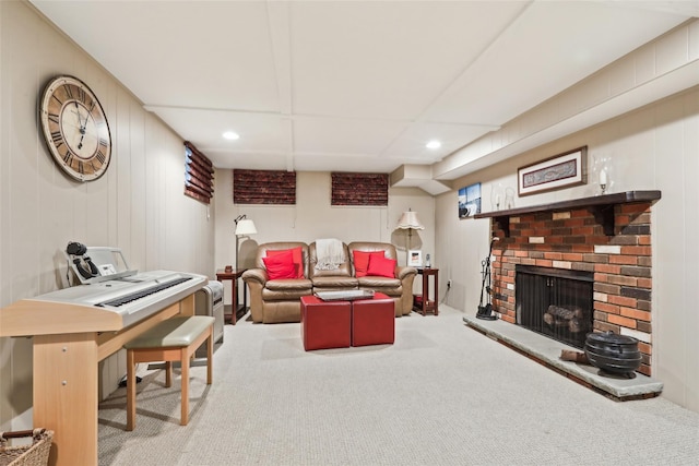 carpeted living area with a fireplace and recessed lighting
