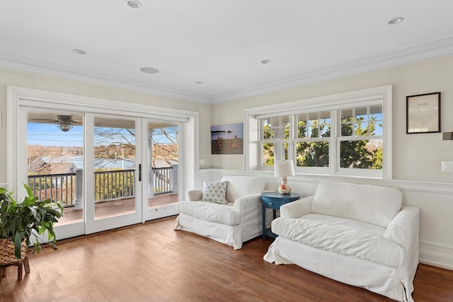 356 Bay Ave, Huntington Bay, NY 11743 - living area featuring crown molding, wood finished floors, a decorative wall, and a wainscoted wall