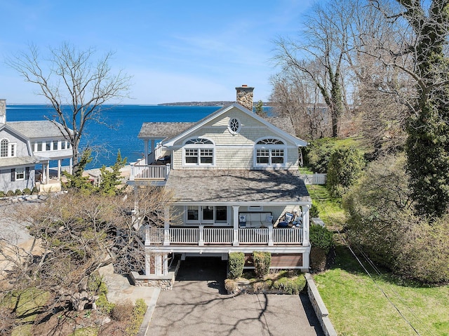 356 Bay Ave, Huntington Bay, NY 11743 - back of house with a water view, a yard, a chimney, a balcony, and roof with shingles