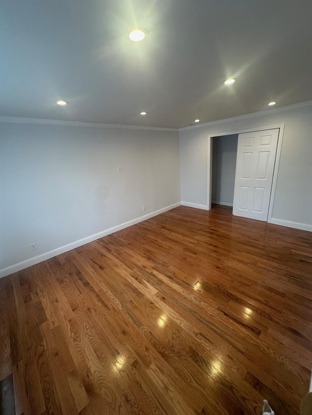 300 Prairie Dr, North Babylon, NY 11703 - below grade area featuring baseboards, ornamental molding, dark wood-type flooring, and recessed lighting