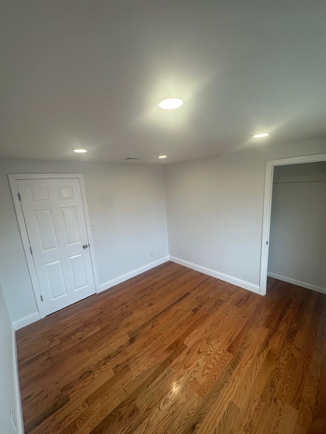 300 Prairie Dr, North Babylon, NY 11703 - empty room featuring dark wood-style flooring, recessed lighting, and baseboards
