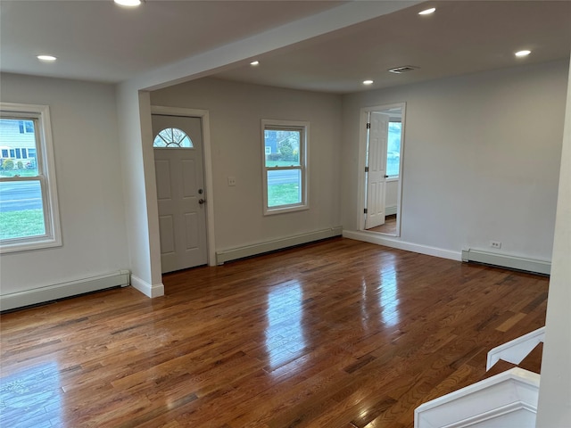 300 Prairie Dr, North Babylon, NY 11703 - entryway with recessed lighting, wood finished floors, and baseboard heating
