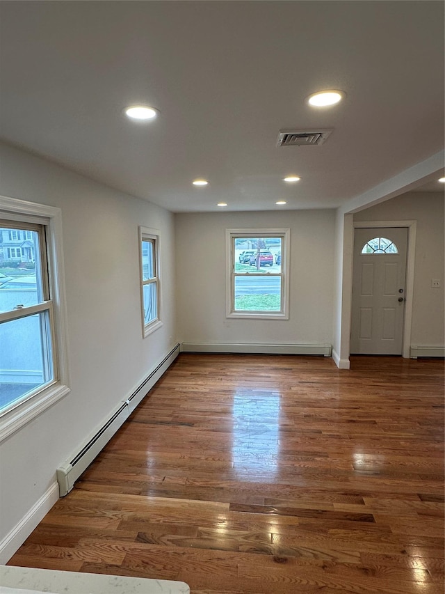 300 Prairie Dr, North Babylon, NY 11703 - foyer with plenty of natural light, a baseboard radiator, and recessed lighting