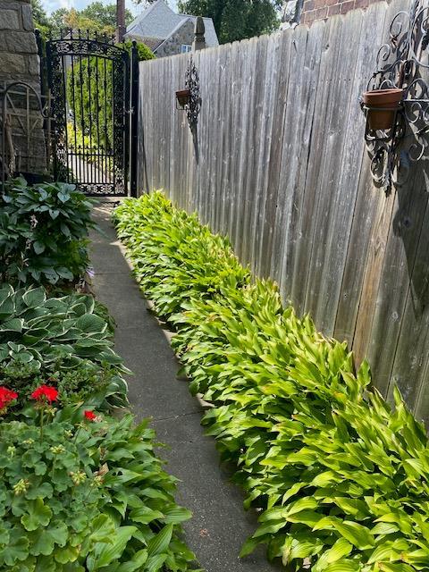 view of yard featuring a gate and fence