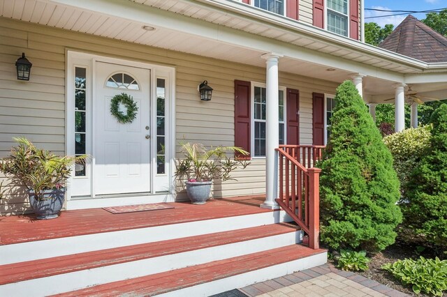 property entrance featuring covered porch