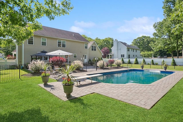 view of pool with a yard, fence private yard, a gazebo, a fenced in pool, and a patio area