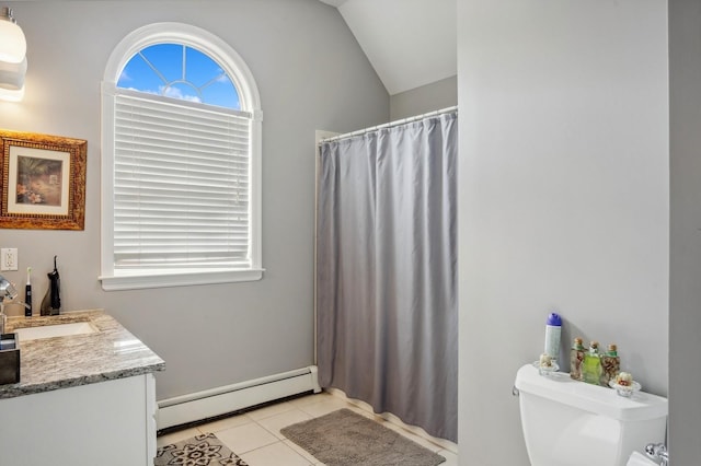 full bath featuring a baseboard heating unit, toilet, vaulted ceiling, vanity, and tile patterned flooring