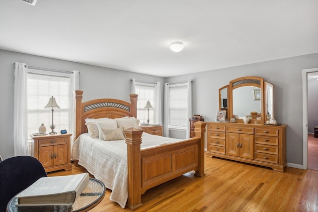 bedroom with light wood finished floors