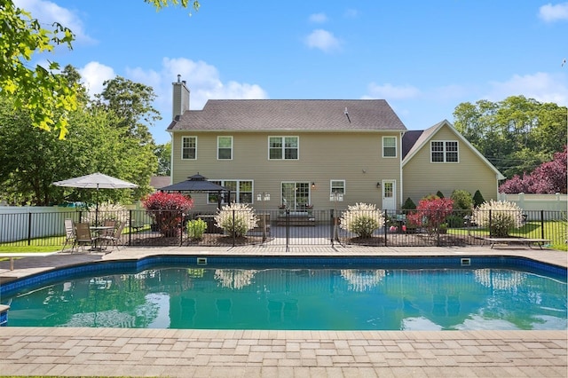 view of swimming pool featuring fence, a patio, and a fenced in pool