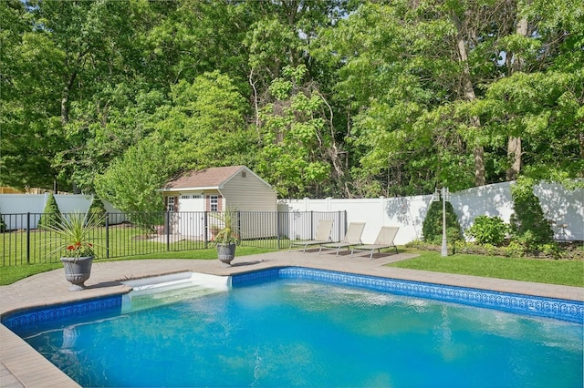 view of pool with a yard, a patio, a fenced in pool, and fence