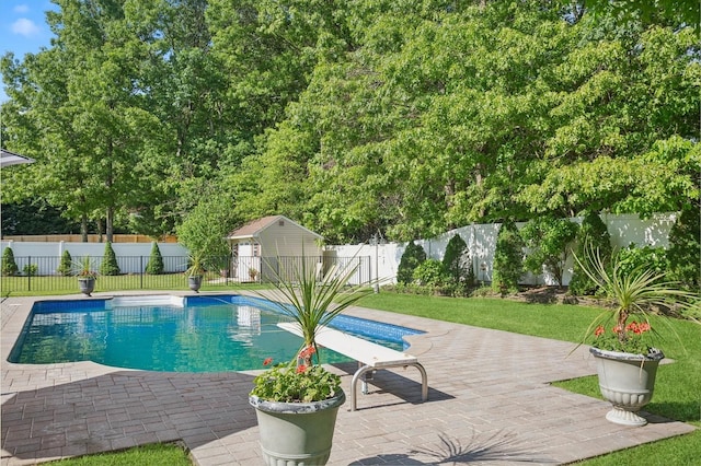 view of pool with a fenced in pool, a patio area, a lawn, and a fenced backyard