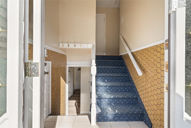 staircase with tile patterned flooring