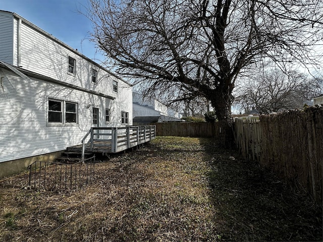 74 Jerusalem Ave, Massapequa, NY 11758 - view of yard featuring a fenced backyard and a wooden deck