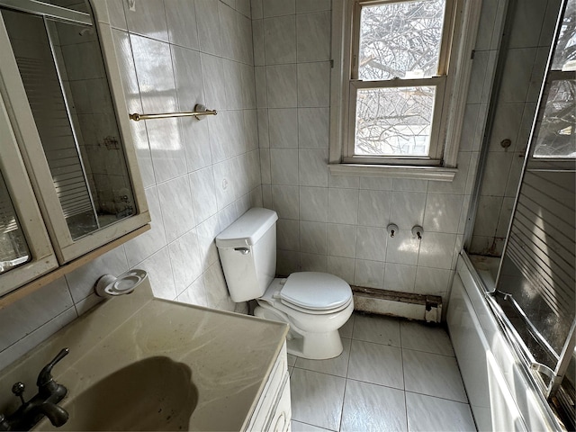 74 Jerusalem Ave, Massapequa, NY 11758 - full bath with tile walls, toilet, a baseboard heating unit, and tile patterned flooring