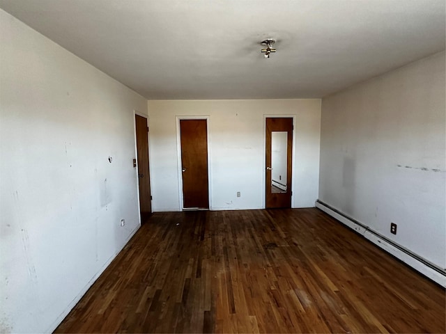 74 Jerusalem Ave, Massapequa, NY 11758 - unfurnished room with wood finished floors and a baseboard radiator