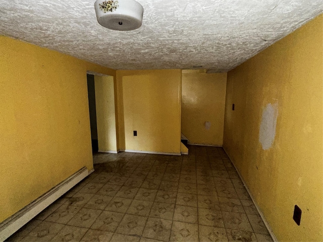 74 Jerusalem Ave, Massapequa, NY 11758 - unfurnished room featuring baseboard heating and a textured ceiling