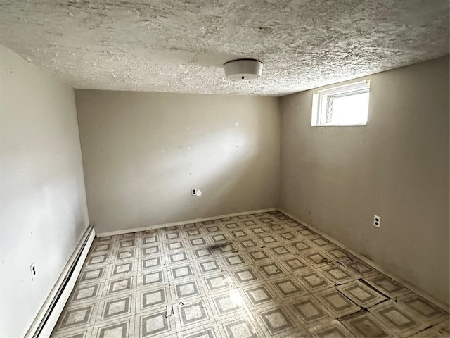 74 Jerusalem Ave, Massapequa, NY 11758 - interior space featuring a baseboard heating unit and a textured ceiling