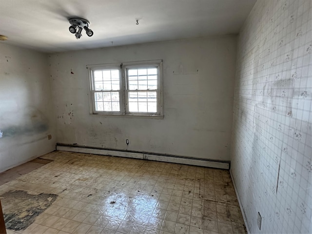 74 Jerusalem Ave, Massapequa, NY 11758 - spare room featuring tile patterned floors and a baseboard heating unit