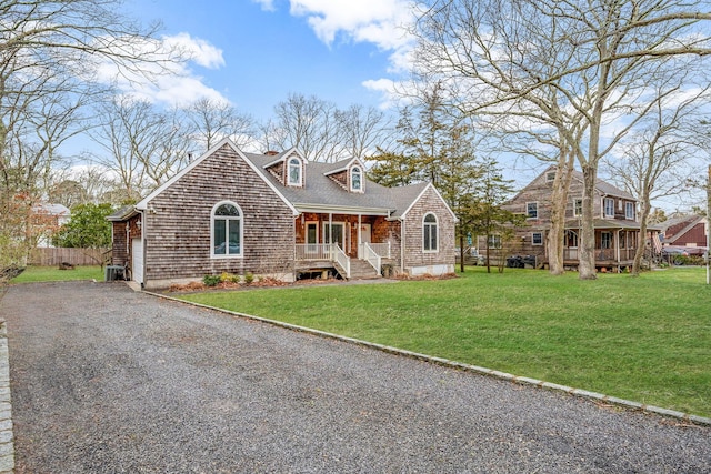 64 Turtle Cove Dr, Southampton, NY 11968 - view of front of property with covered porch, gravel driveway, a shingled roof, and a front lawn