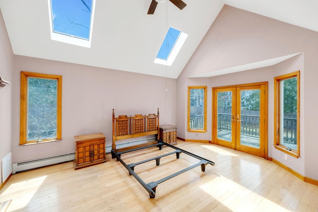 64 Turtle Cove Dr, Southampton, NY 11968 - bedroom with wood finished floors, a skylight, access to outside, and baseboard heating
