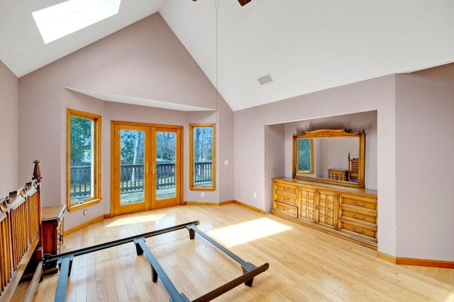 64 Turtle Cove Dr, Southampton, NY 11968 - workout area featuring baseboards, high vaulted ceiling, wood finished floors, and a skylight