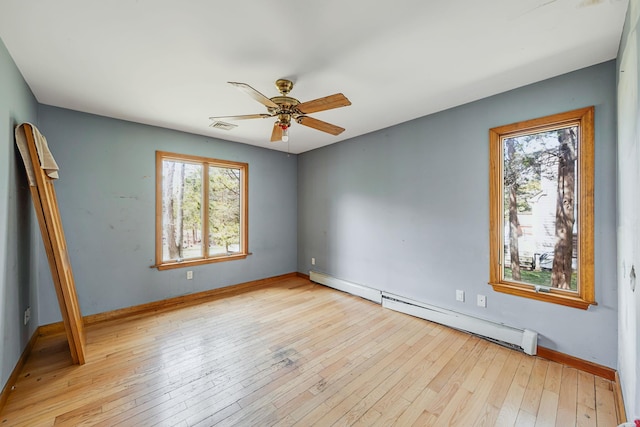 64 Turtle Cove Dr, Southampton, NY 11968 - unfurnished bedroom featuring hardwood / wood-style floors, baseboard heating, multiple windows, and visible vents